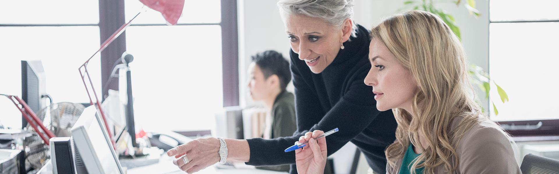 Female colleagues collaborating in the workplace 