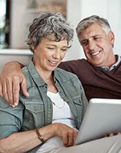 Elderly couple researching pension options