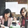 Women collaborating on pension research