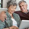 Elderly couple researching pension options