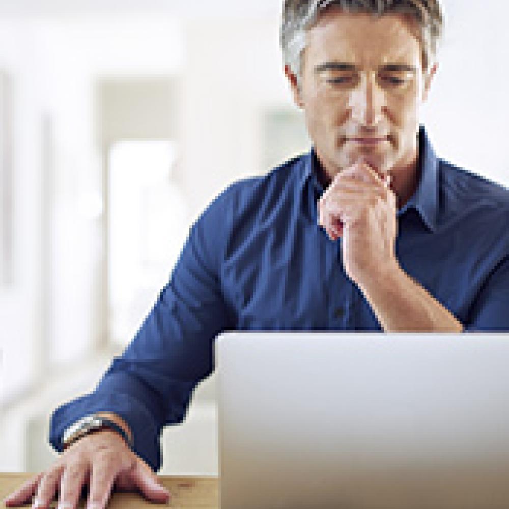 Man accessing data on his laptop